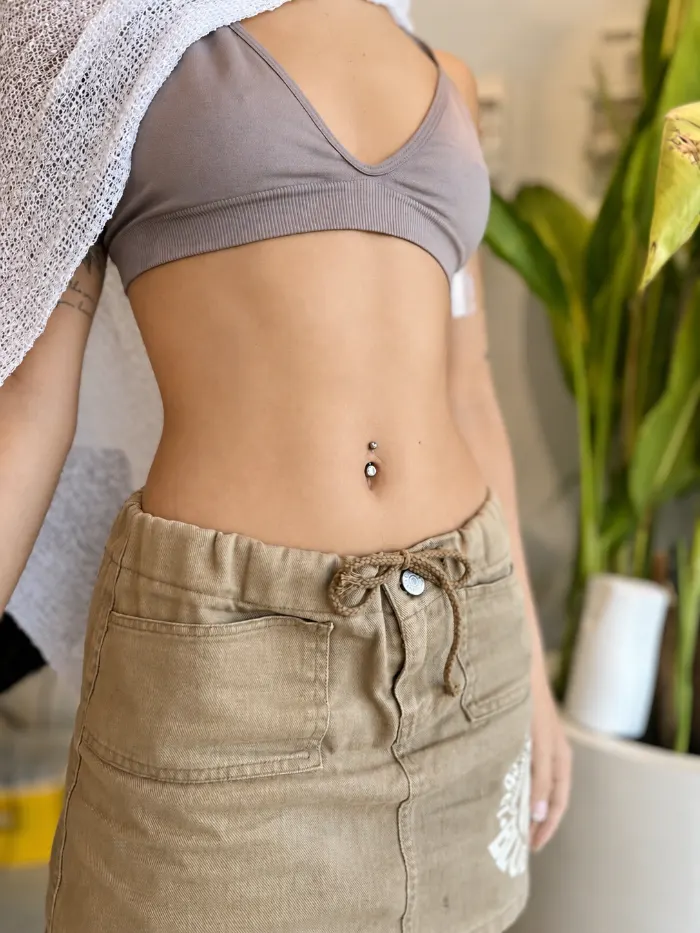 Navel piercing healed on a client