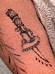Traditional dagger and heart tattoo